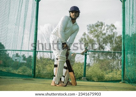 Cricket Batsman waiting bowler to bowl. Player ready to do more practice in nets