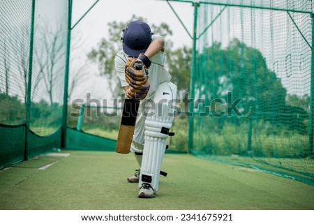 Front view of Cricket Batsman Action, Cricket game closeup player batting ball  Royalty-Free Stock Photo #2341675921