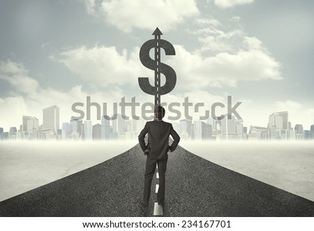 Business man on road heading toward a dollar sign concept