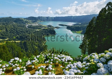 Picturesque paradise of Sete Cidades in Azores, Sao Miguel. Volcanic craters and stunning lakes at sunny day. Ponta Delgada, Portugal. Natural wonders, landmarks and tourist attractions concept Royalty-Free Stock Photo #2341699467