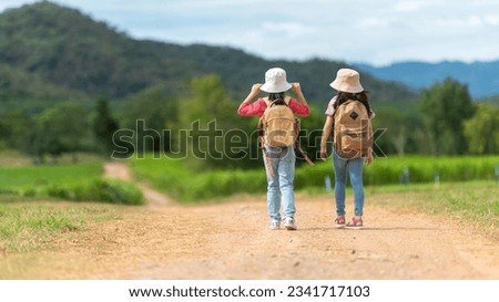Group friend children travel nature summer trips.  Family Asia people tourism walking on road happy and fun explore adventure outdoors for leisure and destination, mountain background. Travel Lifestyl
