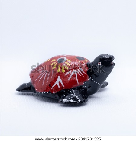 Colorful wooden turtle isolated on white background, Decorated fancy turtle, Hand crafted animals, Sri Lankan turtle Statue, tortoise Statue Sculpture, High quality Photo, Hand crafted turtle