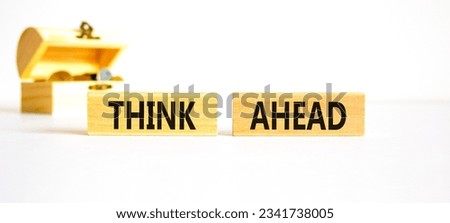 Think ahead symbol. Concept words Think ahead on wooden blocks on a beautiful white background. Wooden chest with coins. Business, support, motivation, psychological think ahead concept. Copy space.