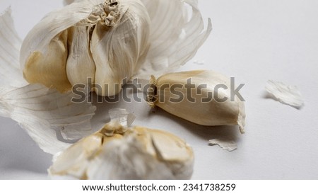 Opened garlic on white background