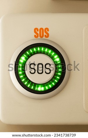 Emergency button with SOS text on the train Royalty-Free Stock Photo #2341738739