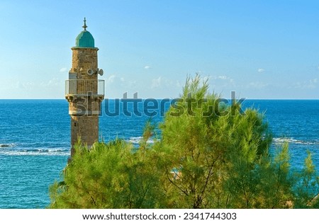 Arabic minaret on the background of the turquoise sea