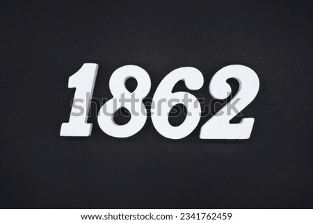 Black for the background. The number 1862 is made of white painted wood.