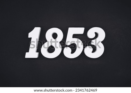Black for the background. The number 1853 is made of white painted wood.