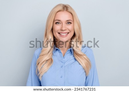 Photo of successful gorgeous blond woman looking camera bleaching white teeth smile isolated grey pastel color background