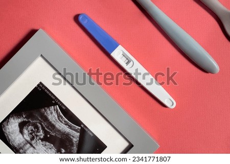 Positive Pregnancy Test. pregnancy test with two stripes. Positive result. Closeup. pregnancy test kit. motherhood concept. baby toys. baby items background. parenthood concept. Pregnancy Test result.