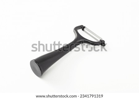 Kitchen utensil peeler on white background.