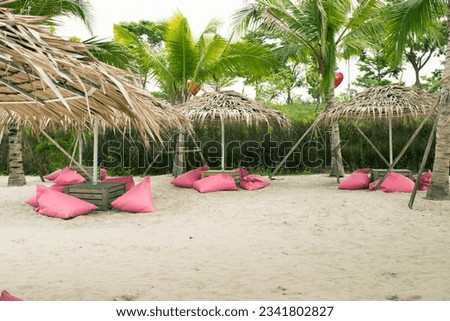 Beautiful Pink beach and a comfortable pink seat cushion at beach.