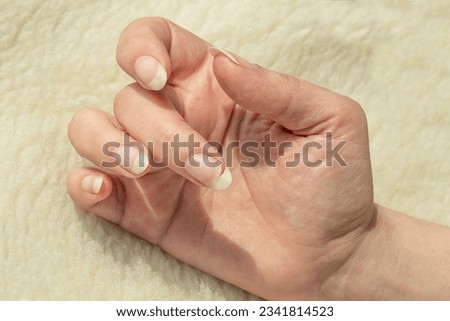 Broken nail. Natural long nails without polish. Cracked, chipped nail. Female fingernails polish-free Royalty-Free Stock Photo #2341814523