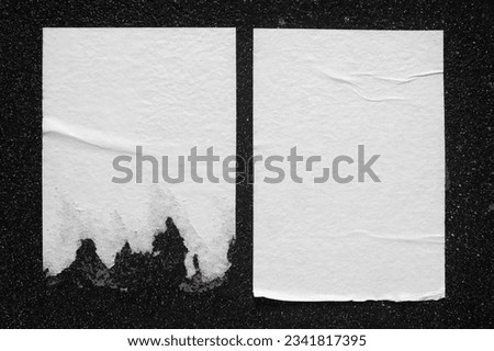 Two white sheets with folds on the wall close-up. Royalty-Free Stock Photo #2341817395