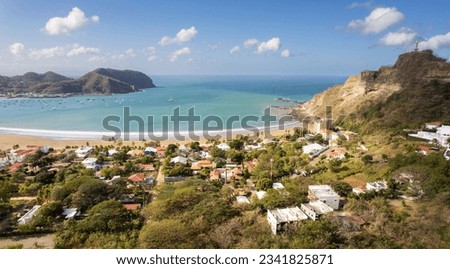 Bay with blue water in Nicaragua San Juan Del Sur aerial drone view on golden time of sunrise Royalty-Free Stock Photo #2341825871