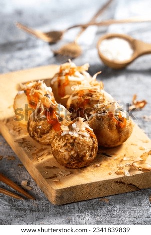 Takoyaki is a dish from the Kansai region of Japan.  small balls with a diameter of 3–5 cm