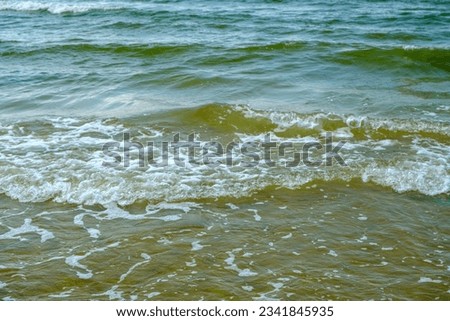 Small waves on the shore of the Baltic Sea in Latvia.