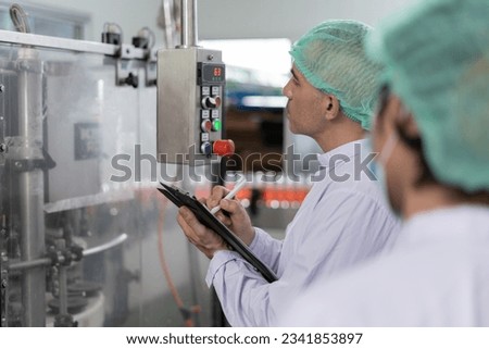 quality supervisor food or beverages technician inspection about quality control food or beverages before send product to the customer. Production leader recheck ingredient and productivity. Royalty-Free Stock Photo #2341853897
