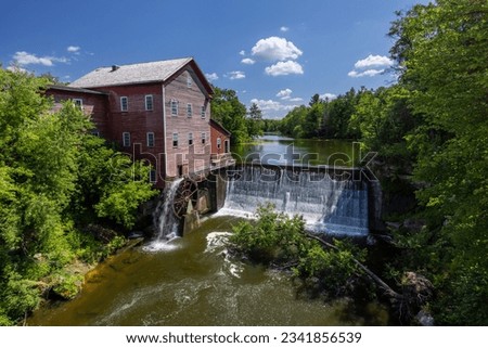 Old Grist Mill with Water Wheel and Dam Royalty-Free Stock Photo #2341856539