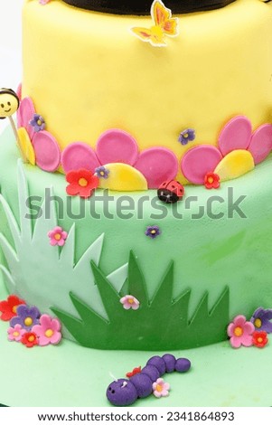 Animal figurine Birthday party cake - Pastel colourful birthday cake. Festive cake with a colourful marzipan