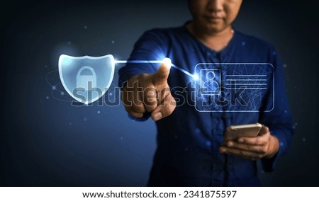 Businessman pushing digital identity card and security shield icon. internet and security data safe concept.