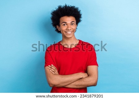 Photo portrait of nice cool funny multinational exchange student guy crossing hands confident isolated blue color background