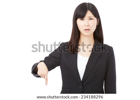 concerned Japanese businesswoman pointing down