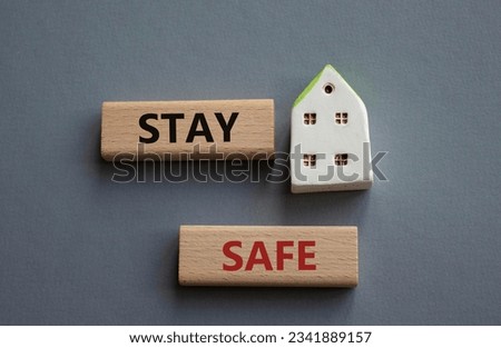 Stay Safe symbol. Concept word Stay Safe on wooden blocks. Beautiful grey background. Business and Stay Safe concept. Concept wordCopy space