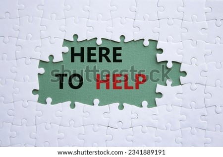 Here to help symbol. White puzzle with words Here to help. Beautiful grey green background. Business and Here to help concept. Copy space. Concept word
