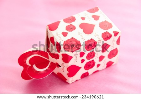 Box packed by heart shapes paper.