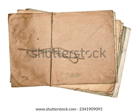 Stack of yellowed and dirty old antique letters and envelopes, tied with string isolated on white background. Royalty-Free Stock Photo #2341909093