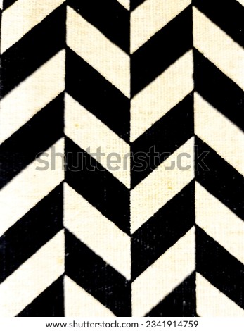 A black and white chevron pattern or background