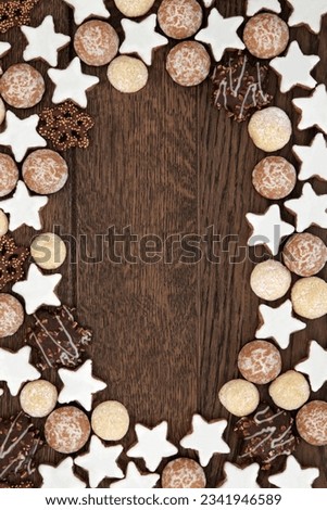 Gingerbread biscuit background border over old oak wood.