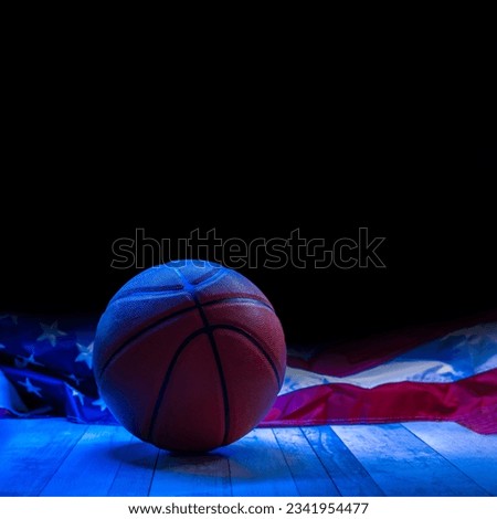 Brown new basketball ball with America flag on dark background. Sport team concept. Sport theme poster, greeting cards, headers, website and app