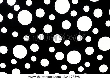 abstract black and white background from different sizes of circles.
