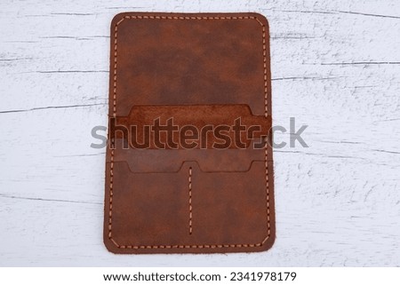 Photo of genuine leather wallet on the background. Wallet photo that can be used for e-commerce, online selling, social media.