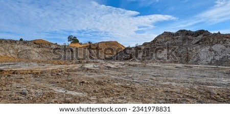 arid land left over from illegal coal mining excavations in Kalimantan, Indonesia Royalty-Free Stock Photo #2341978831