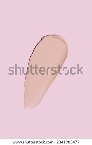 Cosmetic smear of cream texture on a pink background. A dab of foundation or BB cream. Skin care. Royalty-Free Stock Photo #2341983477