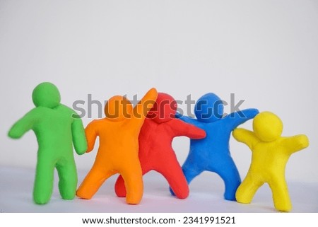 Colorful plasticine people. Human figures from plasticine sculpture. Concept, friendships, partnerships and relationships between people. Sculting enhance imagination.                      Royalty-Free Stock Photo #2341991521