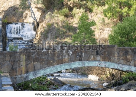 Stream and bridge in Lake Daylesford Central Springs Reserve Royalty-Free Stock Photo #2342021343