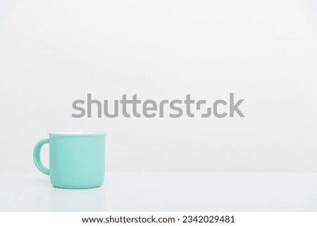 Realistic Mild green cup isolated on white table and on white background