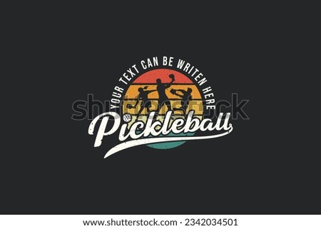 pickleball vector graphic with a combination of three pickleball players, colorful circles, and lettering in emblematic and vintage style. Great for logos, t-shirts, stickers, etc. Royalty-Free Stock Photo #2342034501