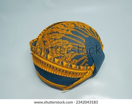 traditional ethnic culture hat with batik motif from Javanese Indonesia in white isolated background. blangkon or blankon