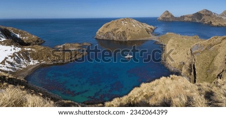 Cooper Bay panorama, Blue water surrounded by land,