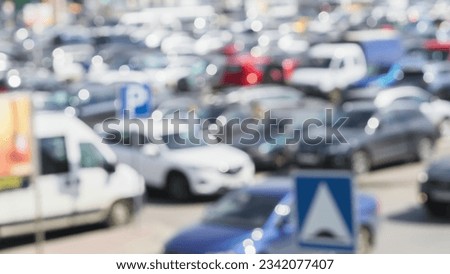 Blurred outdoor parking cars in city at peak hour.