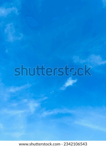 Blue sky slightly white cloud. Beautiful sky. Royalty-Free Stock Photo #2342106543