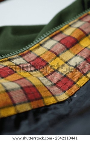 fabric with a red and yellow checkered pattern, can be used as an abstract background