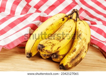 Close up of Over Ripe Bananas isolated of a wooden background with copy space Royalty-Free Stock Photo #2342127061