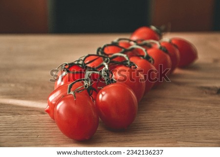 Close-up shot of cheery tomatoes on a wooden table