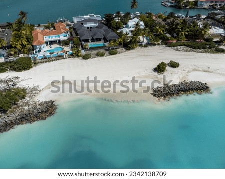 from the sky with drone on the island of Antigua in the Caribbean sea, with white beach and transparent sea